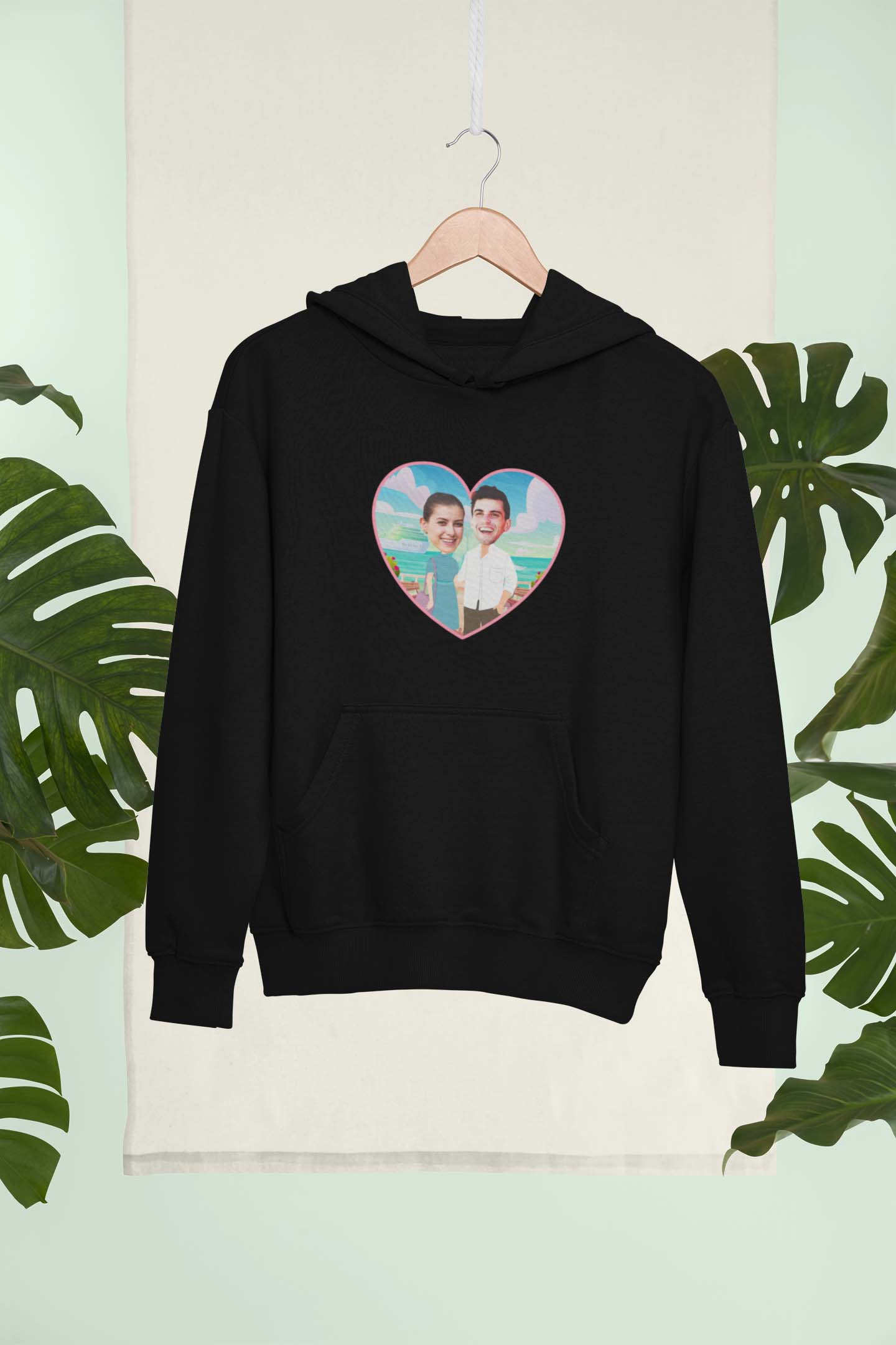 mockup-of-a-hanged-pullover-hoodie-in-a-tropical-setting-270202 Felpa cappuccio personalizzata cartoon coppia, idea regalo per coppia san valentino, natale, anniversario
